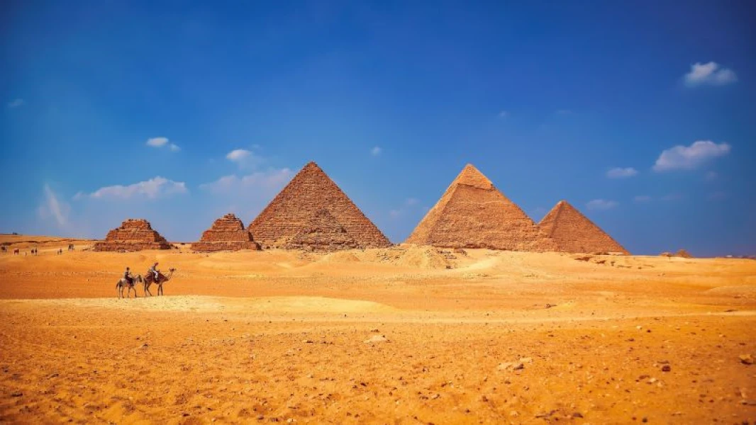 Pyramids of Giza under clear blue sky