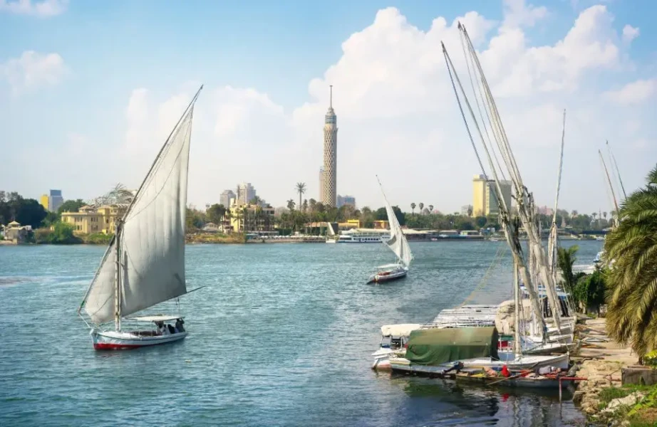 Traditional felucca boat sailing on the Nile River.