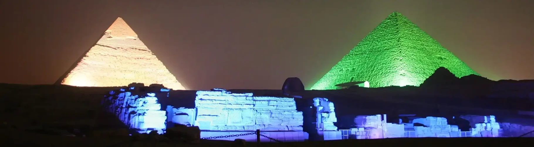 Pyramids illuminated at night